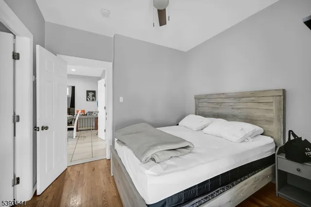 a bedroom with a bed and a table in it