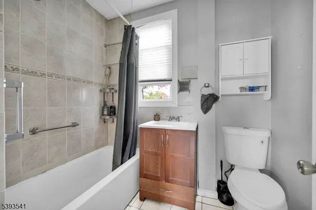 a dining room with furniture a window and kitchen view