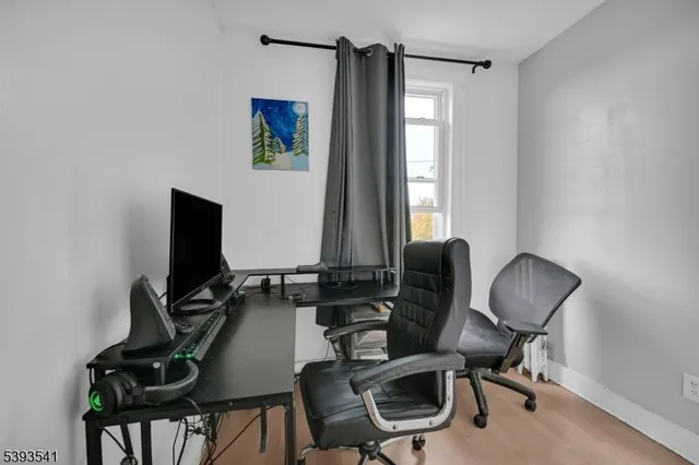 a view of a backyard with table and chairs with wooden floor and fence