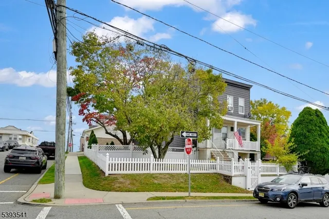 a view of a cars park in front of a house