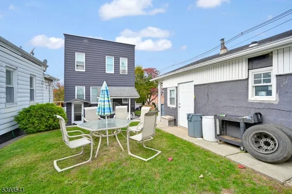 a view of backyard with a patio