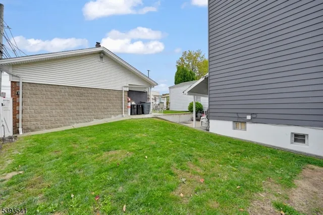 a view of a car parked front of a house