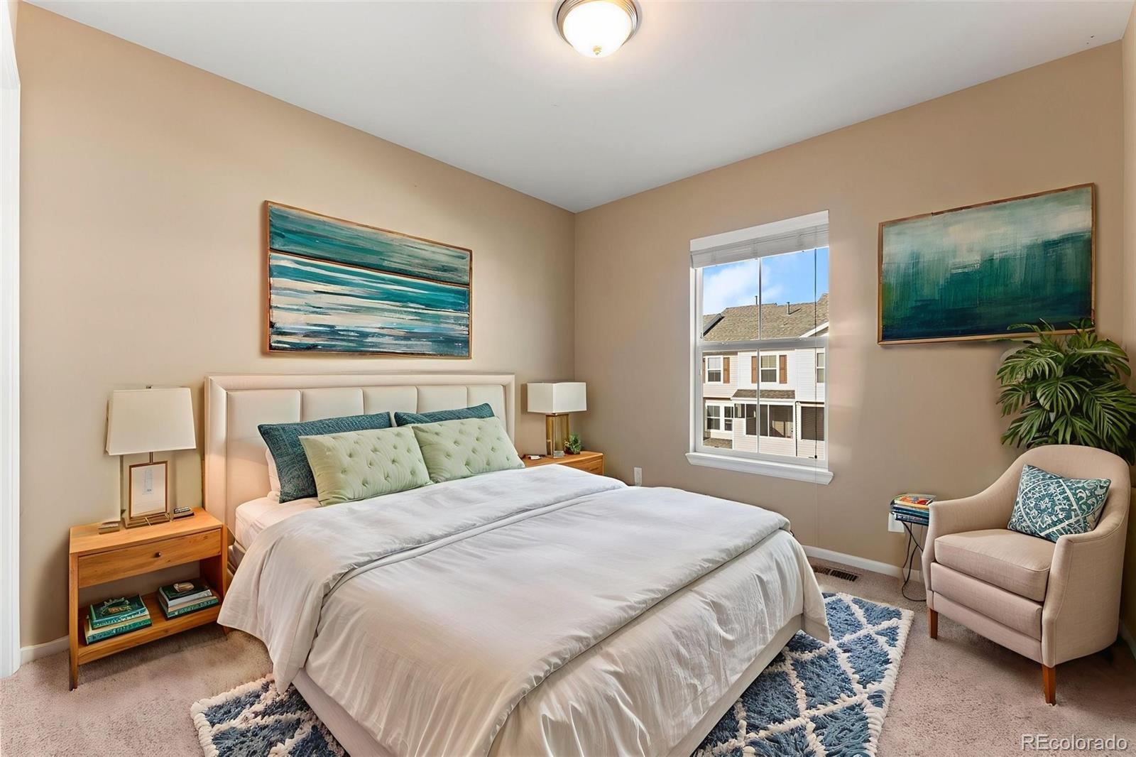 2020 Squawbush Ridge Grove Colorado Springs, CO 80910 - Photo 11 of 29 a bedroom with a bed and a couch