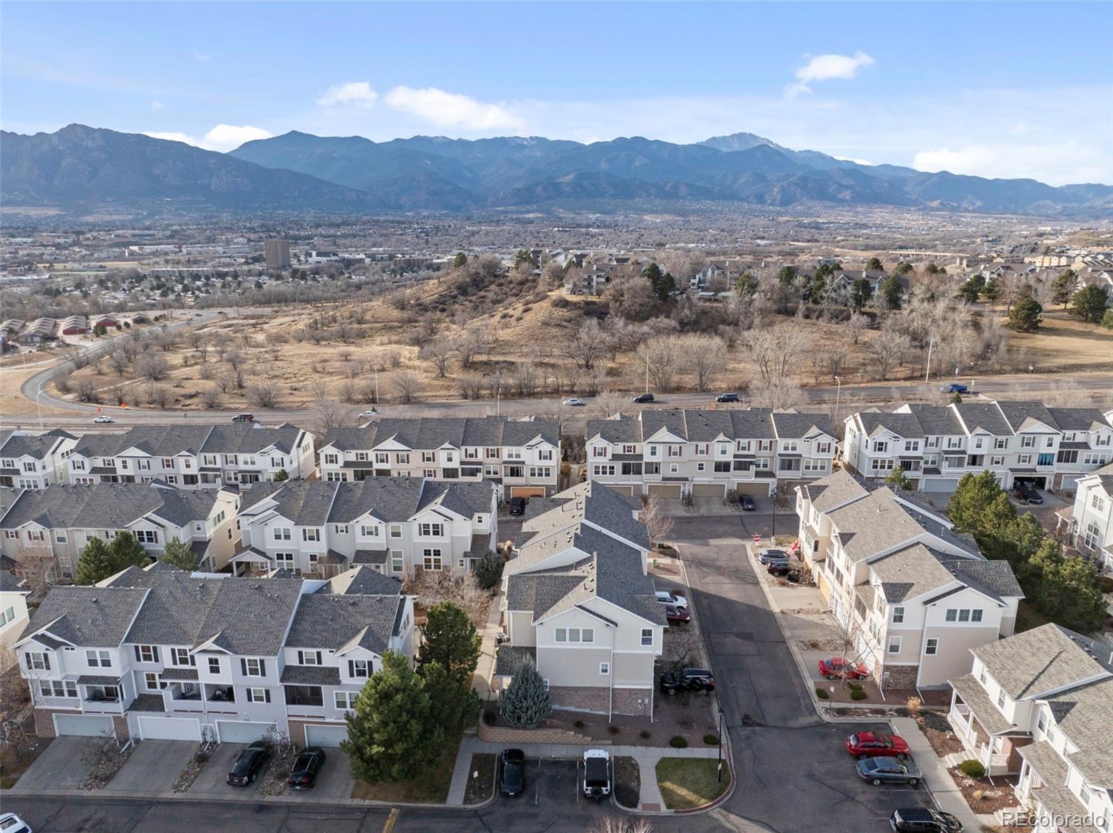 2020 Squawbush Ridge Grove Colorado Springs, CO 80910 - Photo 26 of 29 an aerial view of residential house and green space
