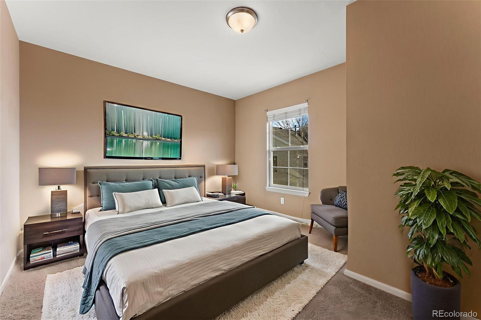 2020 Squawbush Ridge Grove Colorado Springs, CO 80910 - Photo 8 of 29 a bedroom with a bed and a window