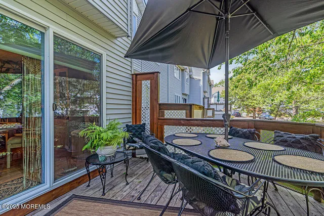 a outdoor dining space with furniture and garden view