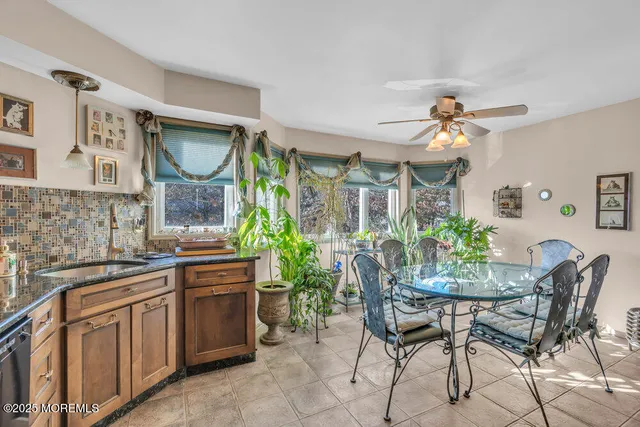 a kitchen with a table and chairs in it