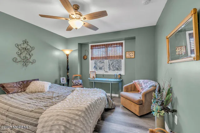 a bedroom with a bed and a couch