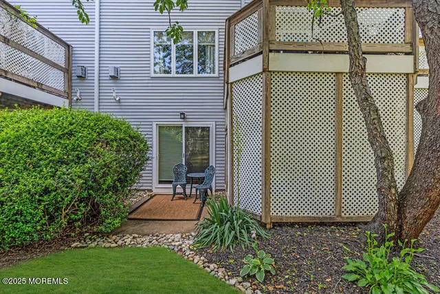 a view of a backyard and a fence