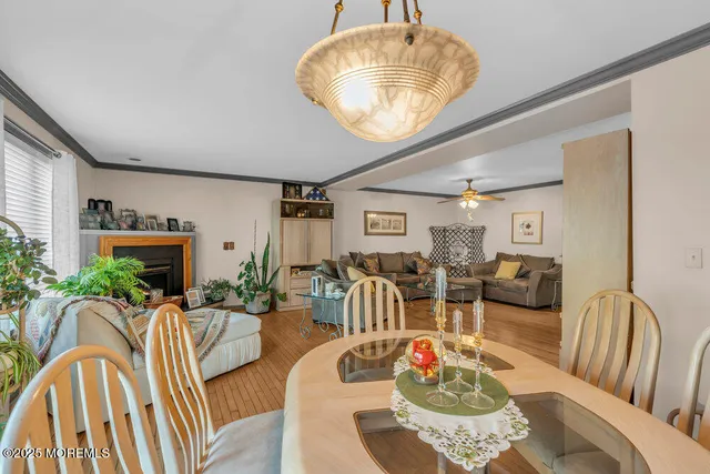 a living room with furniture chandelier and a table