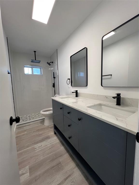 2115 North Ocean Boulevard, Unit 11 Fort Lauderdale, FL 33305 - Photo 11 of 17 a bathroom with double vanity and a mirror