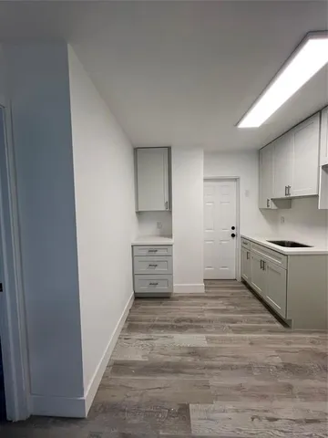 a kitchen with granite countertop a refrigerator and a stove