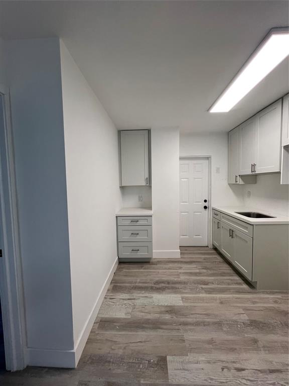 2115 North Ocean Boulevard, Unit 11 Fort Lauderdale, FL 33305 - Photo 2 of 17 a kitchen with granite countertop a refrigerator and a stove