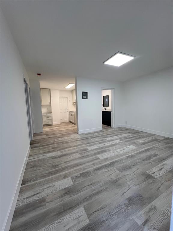 2115 North Ocean Boulevard, Unit 11 Fort Lauderdale, FL 33305 - Photo 6 of 17 a view of a room with wooden floor
