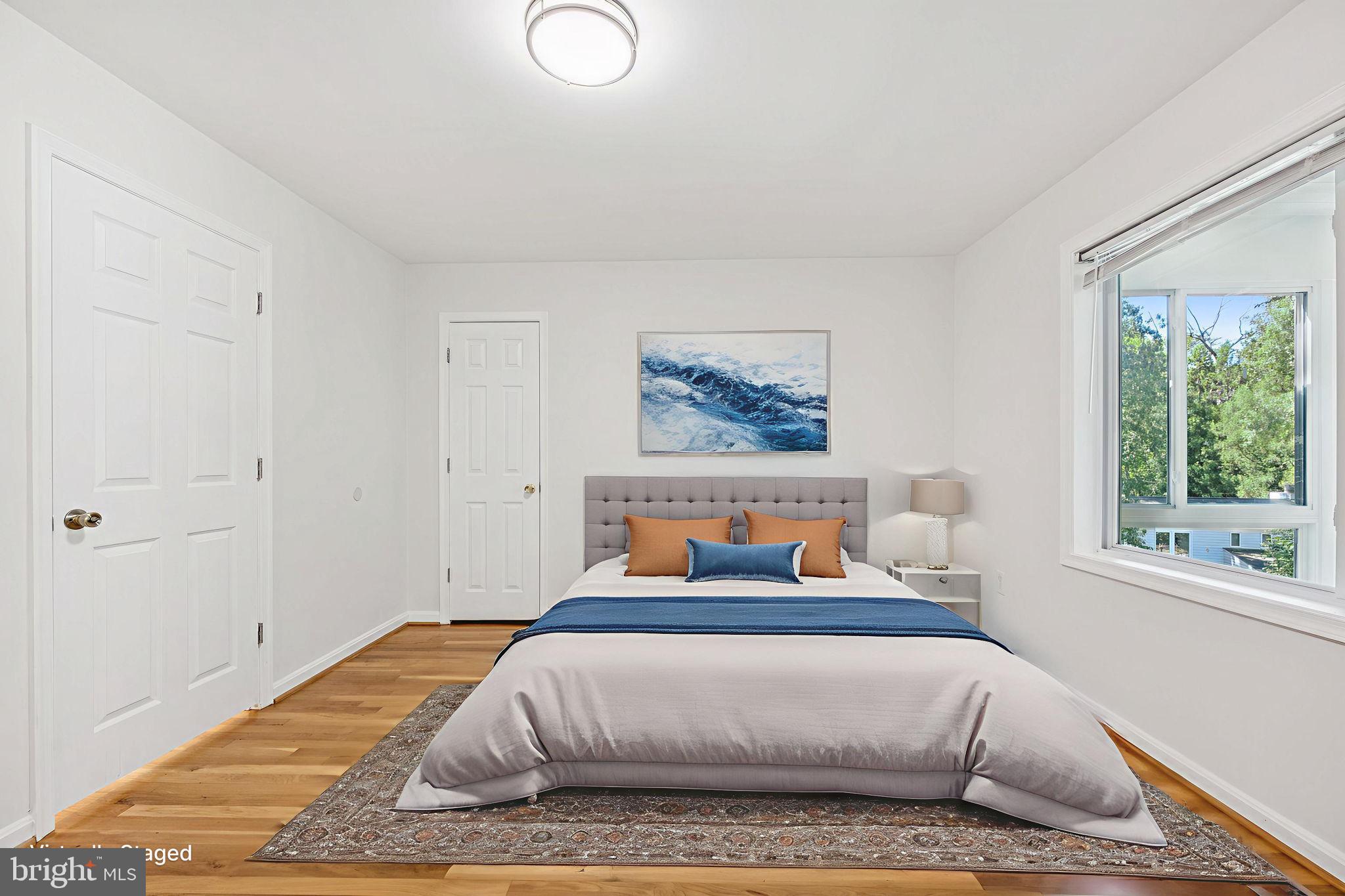 10600 Vantage Court Potomac, MD 20854 - Photo 23 of 51 a bedroom with a bed and wooden floor