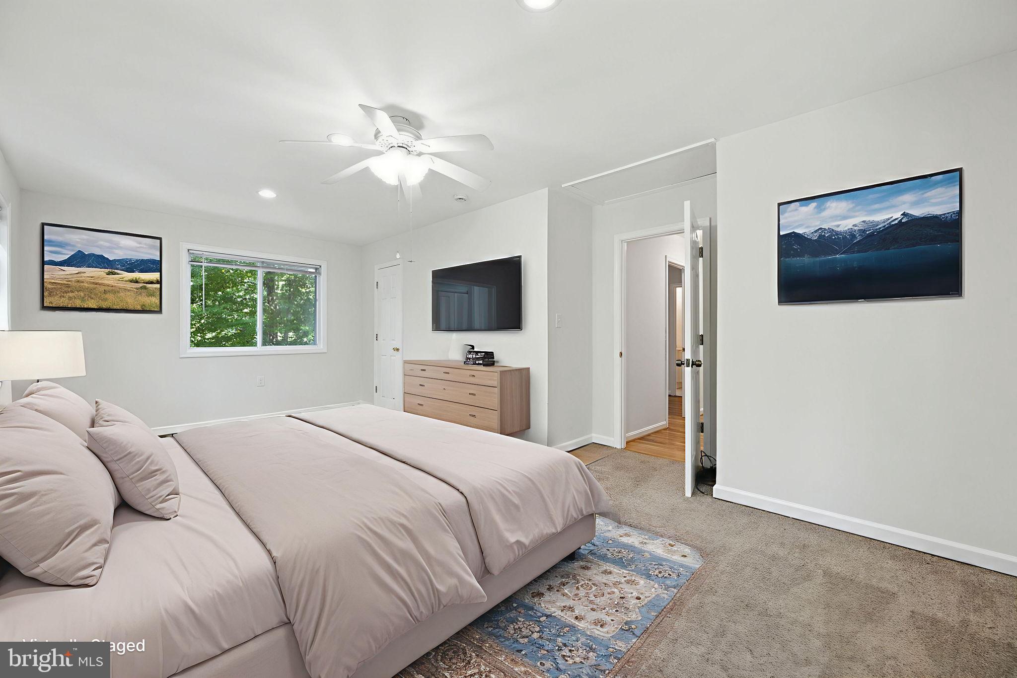 10600 Vantage Court Potomac, MD 20854 - Photo 26 of 51 a bedroom with a large bed and a flat screen tv