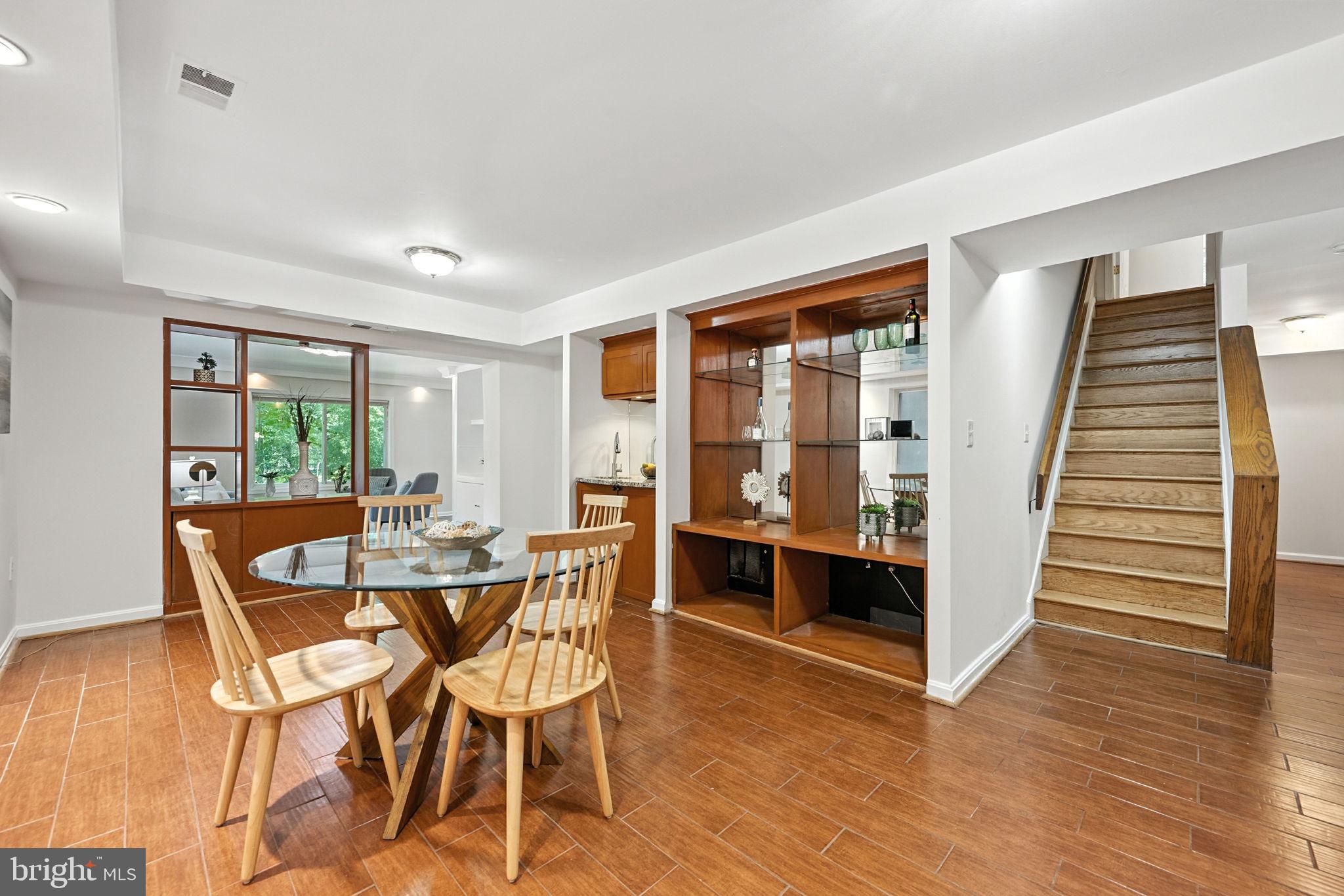 10600 Vantage Court Potomac, MD 20854 - Photo 28 of 51 a view of a dining room with furniture and wooden floor