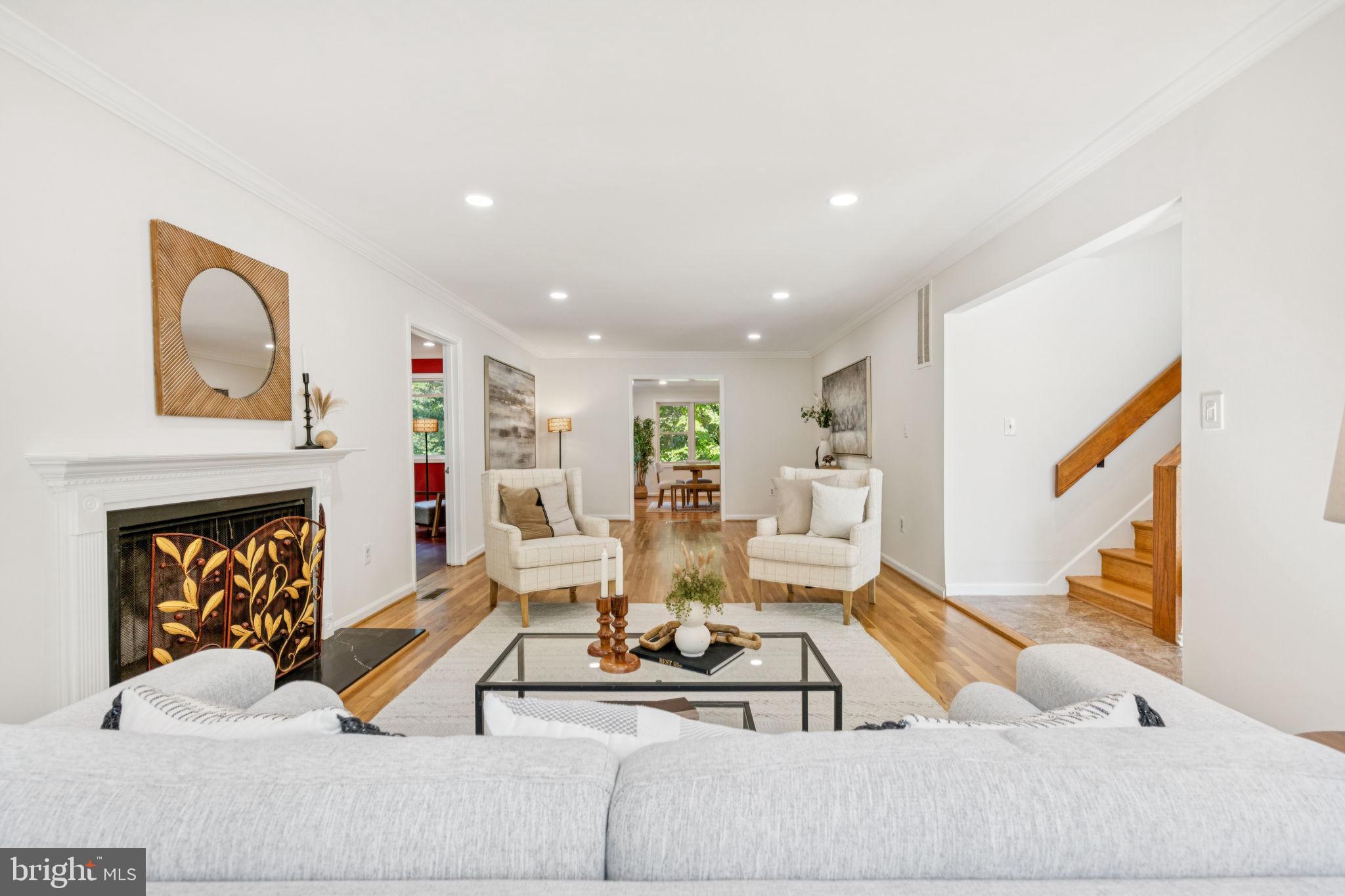 10600 Vantage Court Potomac, MD 20854 - Photo 3 of 51 a living room with furniture kitchen view and a fireplace