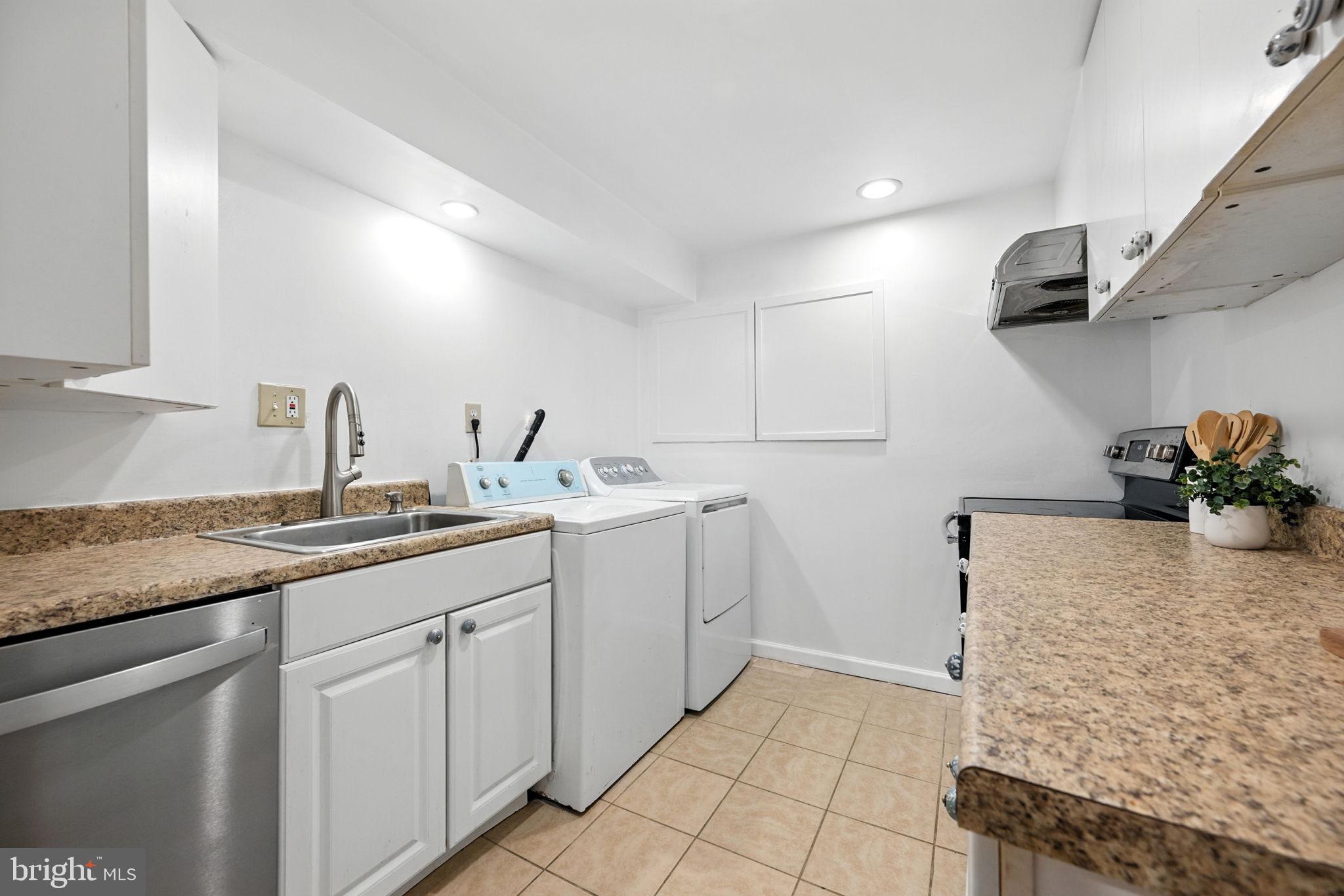 10600 Vantage Court Potomac, MD 20854 - Photo 32 of 51 a kitchen with a sink and cabinets