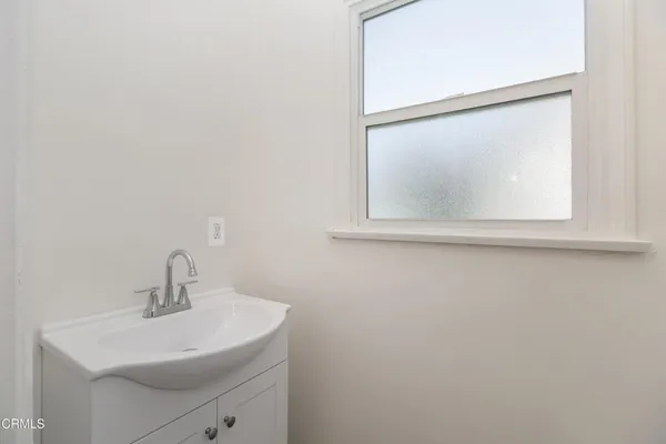 a bathroom with a sink and mirror