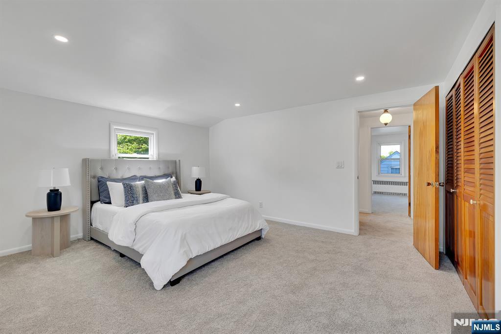 287 Jackson Avenue Rutherford, NJ 07070 - Photo 18 of 36 a bed room with a bed and a window