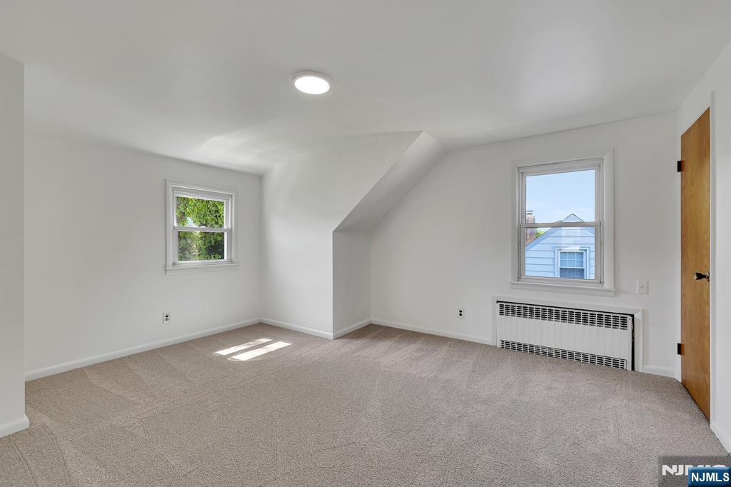 287 Jackson Avenue Rutherford, NJ 07070 - Photo 23 of 36 an empty room with windows