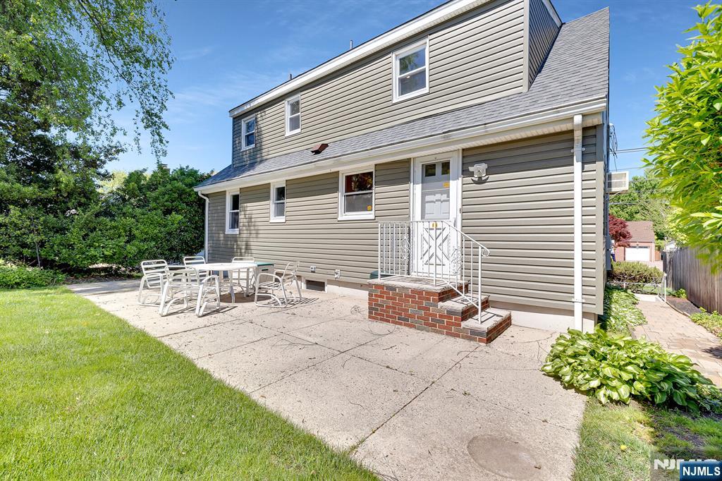 287 Jackson Avenue Rutherford, NJ 07070 - Photo 25 of 36 a view of a house with backyard and sitting area