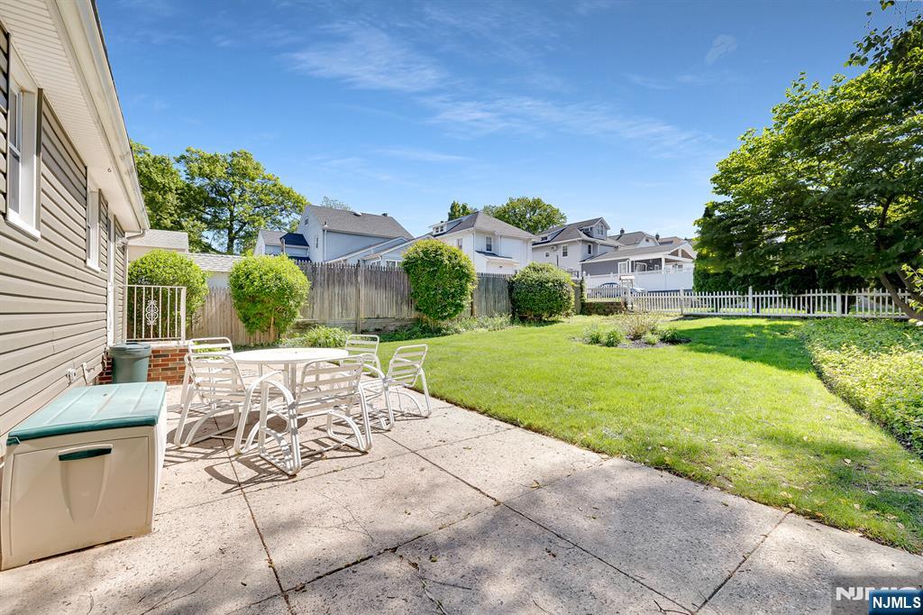 287 Jackson Avenue Rutherford, NJ 07070 - Photo 26 of 36 a view of an house with backyard and a tree
