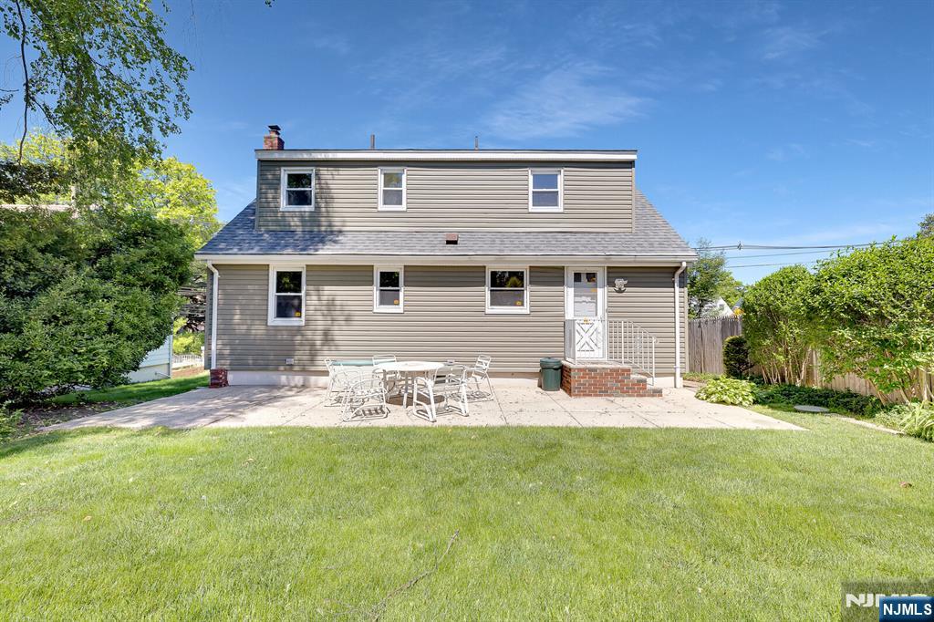 287 Jackson Avenue Rutherford, NJ 07070 - Photo 28 of 36 a front view of house with yard and seating area