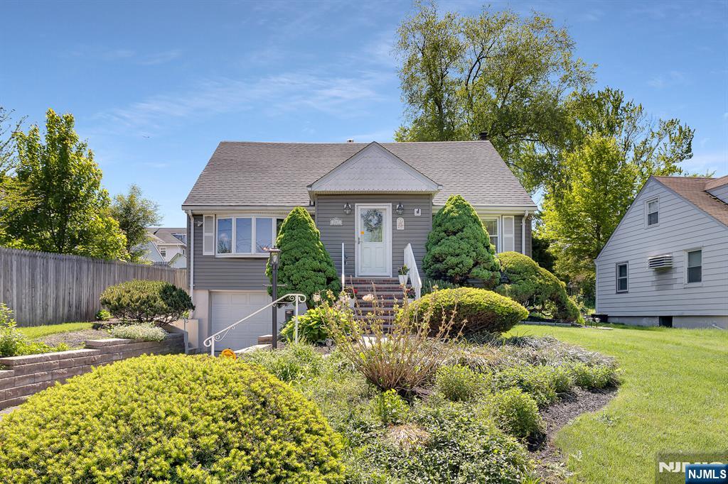 287 Jackson Avenue Rutherford, NJ 07070 - Photo 32 of 36 a front view of house with yard and green space