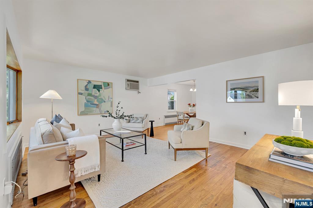 287 Jackson Avenue Rutherford, NJ 07070 - Photo 4 of 36 a living room with furniture and a wooden floor