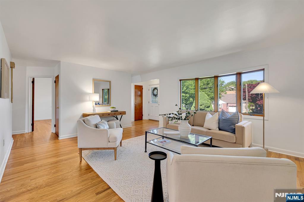 287 Jackson Avenue Rutherford, NJ 07070 - Photo 6 of 36 a living room with furniture and a large window