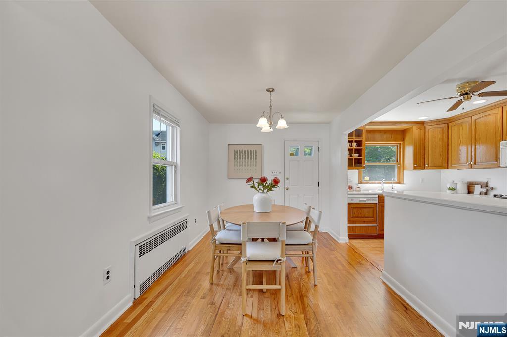 287 Jackson Avenue Rutherford, NJ 07070 - Photo 7 of 36 a view of a dining room with furniture window and wooden floor
