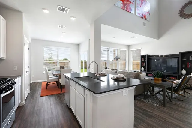 a bedroom with a bed and painting on the wall