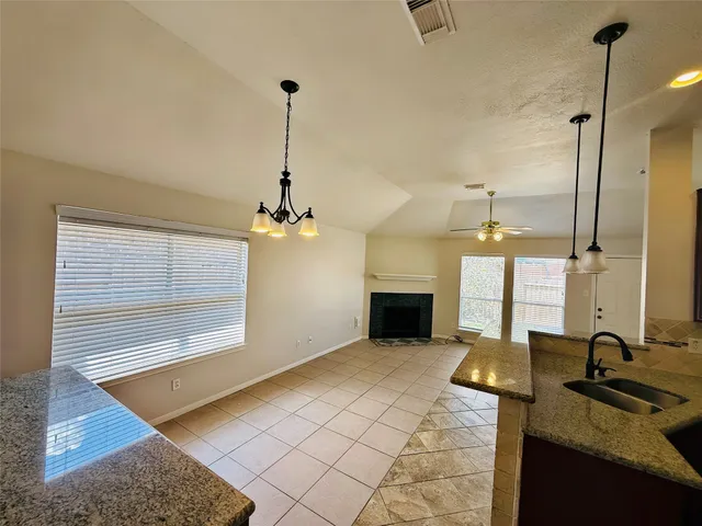 a view of a kitchen with a sink and a kitchen counter top