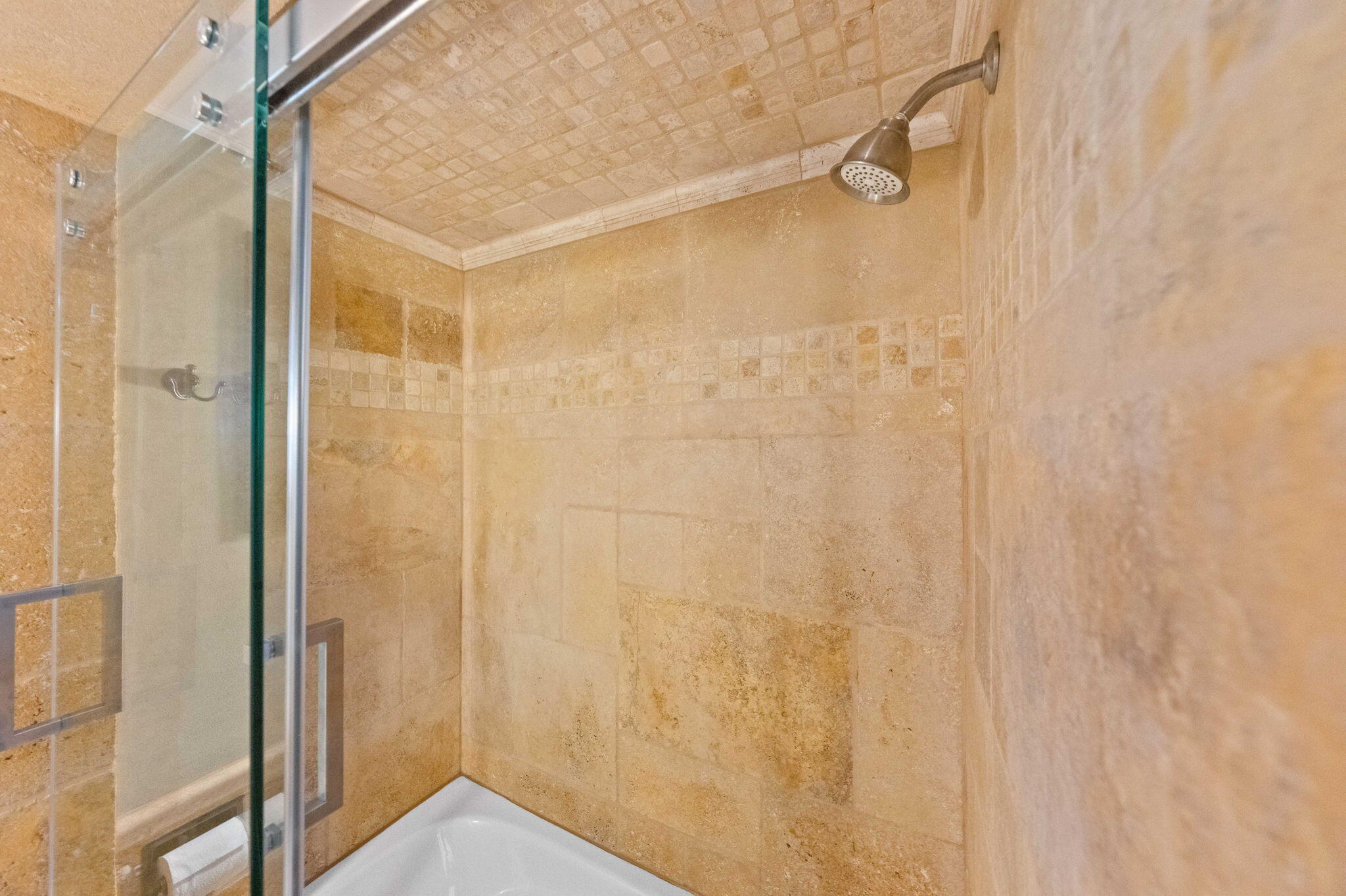 21925 Bear Creek Road Bend, OR 97702 - Photo 48 of 104 Bathroom on the main level with travertine tile, soaking tub and glass shower