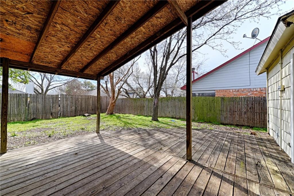 4652 Misty Ridge Drive Fort Worth, TX 76137 - Photo 21 of 24 a view of backyard with wooden fence