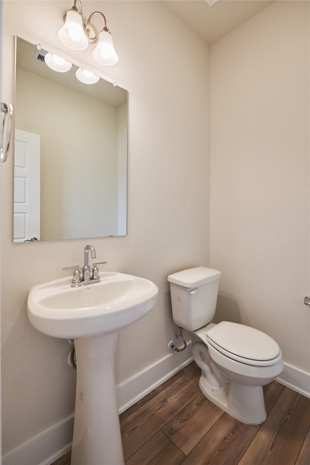 10647 Whitejacket Conroe, TX 77385 - Photo 33 of 38 a bathroom with a toilet sink and mirror