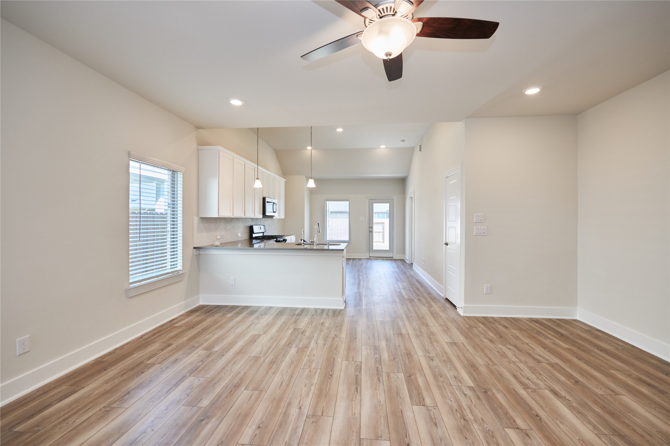 10647 Whitejacket Conroe, TX 77385 - Photo 9 of 38 a view of a kitchen with a sink and a window