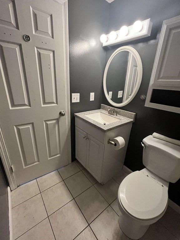 1475 Braley Road, Unit 21 New Bedford, MA 02745 - Photo 13 of 18 a bathroom with a toilet sink and mirror