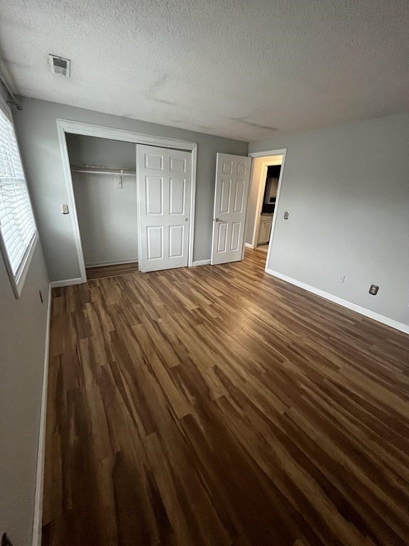1475 Braley Road, Unit 21 New Bedford, MA 02745 - Photo 15 of 18 a view of empty room with wooden floor