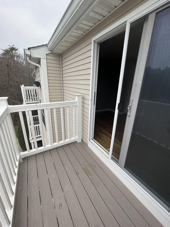 1475 Braley Road, Unit 21 New Bedford, MA 02745 - Photo 3 of 18 a view of wooden balcony