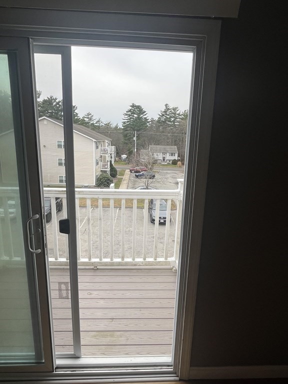 1475 Braley Road, Unit 21 New Bedford, MA 02745 - Photo 4 of 18 a view of a glass door with a view of room