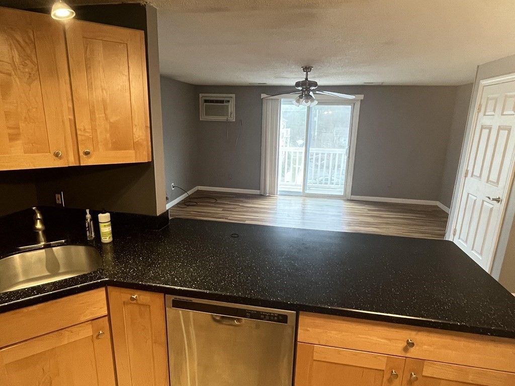 1475 Braley Road, Unit 21 New Bedford, MA 02745 - Photo 5 of 18 a view of a kitchen with kitchen island