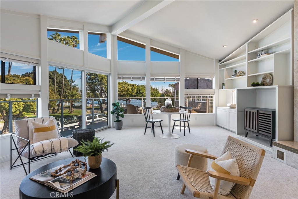 6090 Appian Way Long Beach, CA 90803 - Photo 16 of 41 a living room with furniture and a fireplace