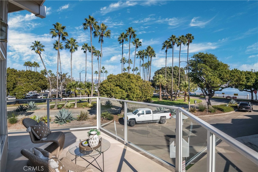 6090 Appian Way Long Beach, CA 90803 - Photo 18 of 41 a view of a swimming pool with outdoor seating and plants