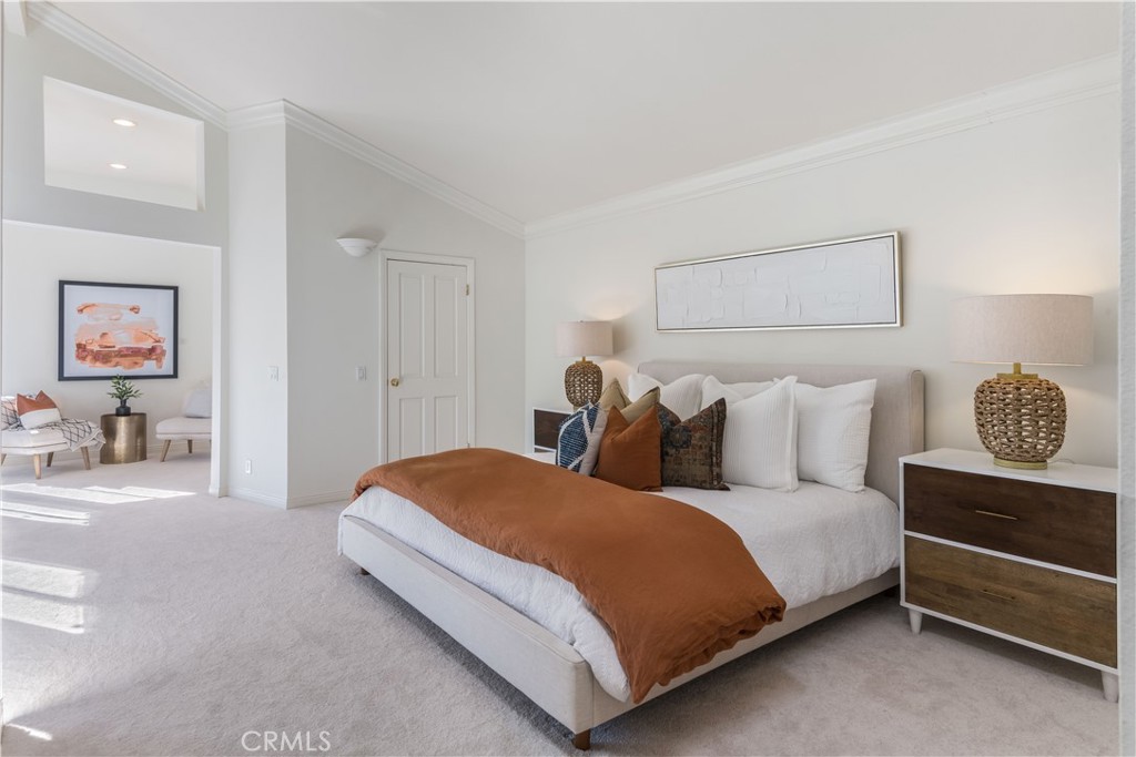 6090 Appian Way Long Beach, CA 90803 - Photo 19 of 41 a spacious bedroom with a bed and a lamp