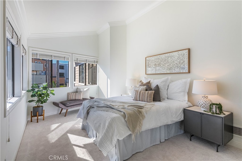 6090 Appian Way Long Beach, CA 90803 - Photo 26 of 41 a bed room with a bed and a couch