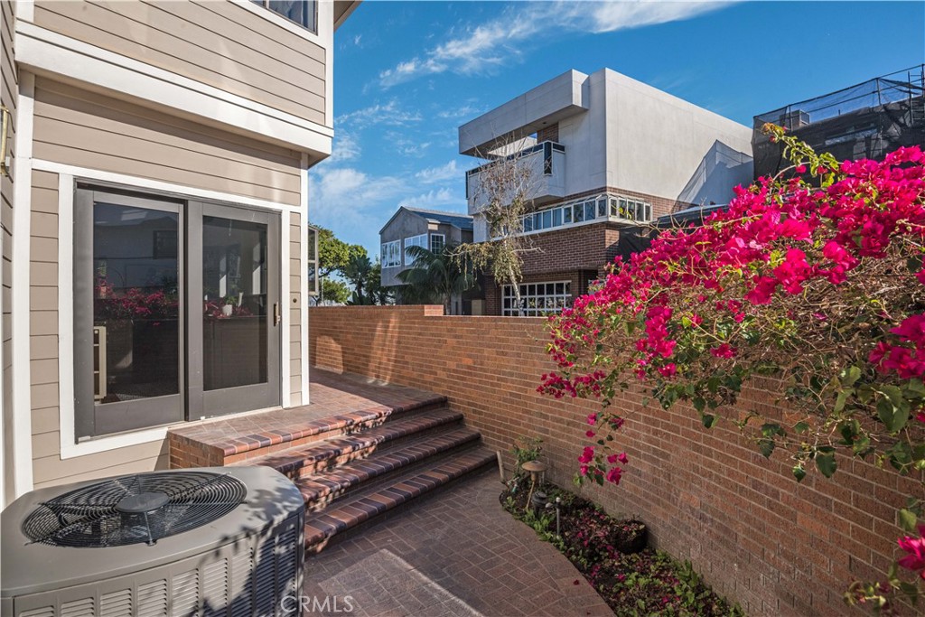 6090 Appian Way Long Beach, CA 90803 - Photo 29 of 41 a front view of a house with a yard and fountain