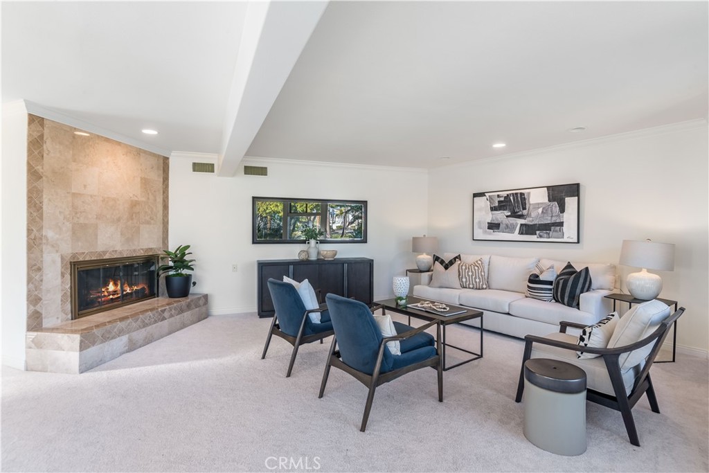 6090 Appian Way Long Beach, CA 90803 - Photo 7 of 41 a living room with furniture a fireplace and a flat screen tv